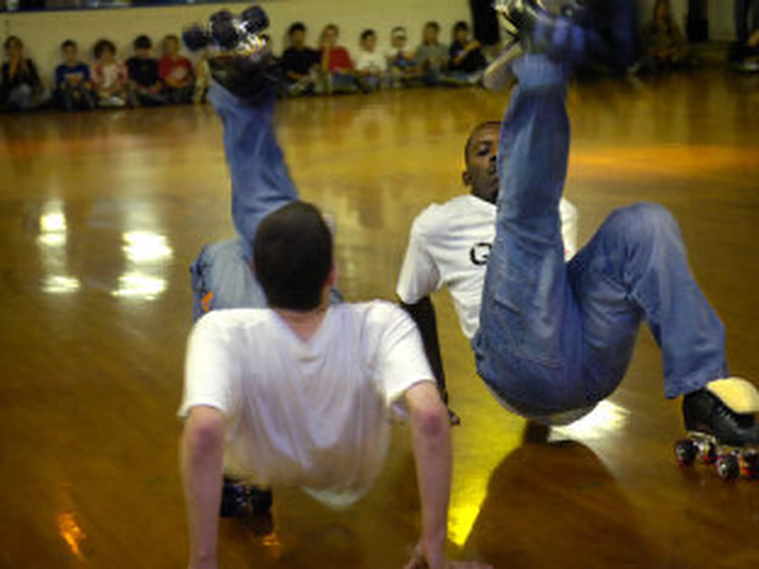 two jam skaters performing.